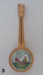 Banjo with drawing of Person in Sailboat