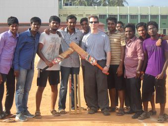 group of students with cricket bats
