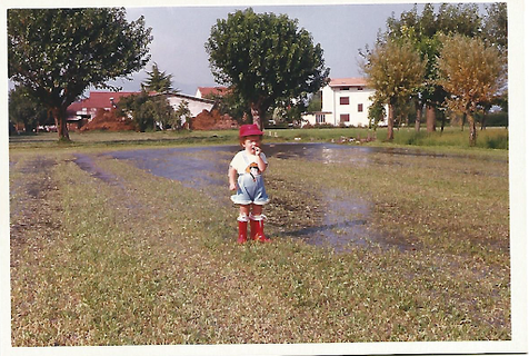 old photo of kid in field